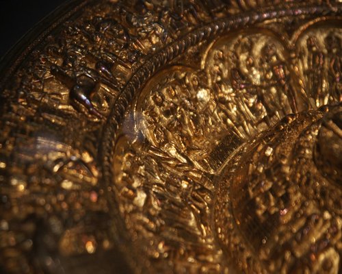 A handcrafted hammered gold bangle